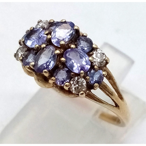 428 - A 9K Yellow Gold Amethyst and White Stone Cluster Ring.
Size P. 2.43g total weight.