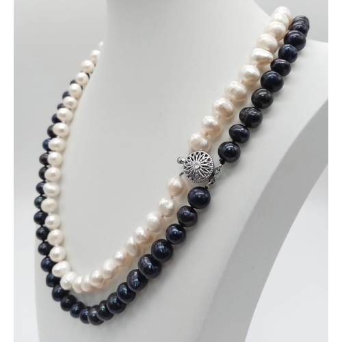 359 - A White and Black Two-Row Freshwater Akoya Pearl Necklace. 44 - 48cm.