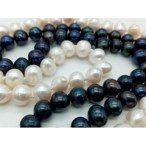 359 - A White and Black Two-Row Freshwater Akoya Pearl Necklace. 44 - 48cm.