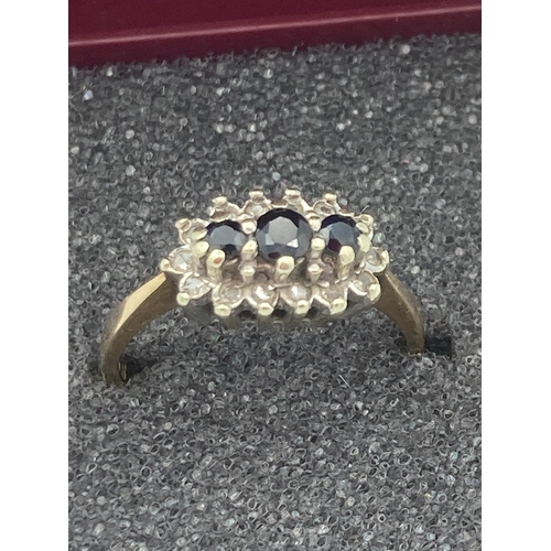 7 - 9 carat GOLD and SAPPHIRE TRILOGY RING. Having three SAPPHIRES set to top with DIAMOND surround. Ful... 