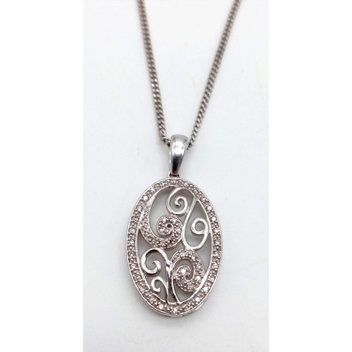 282 - A 9k White Gold and Diamond Oval Pendant on a 9K White Gold Necklace. 6g total weight. 46 and 2.5cm.