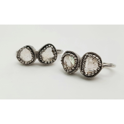 1205 - A Pair of Antique Old-Cut Rose Coloured Diamond Earrings. 
Set in white metal. 3.21g total weight.