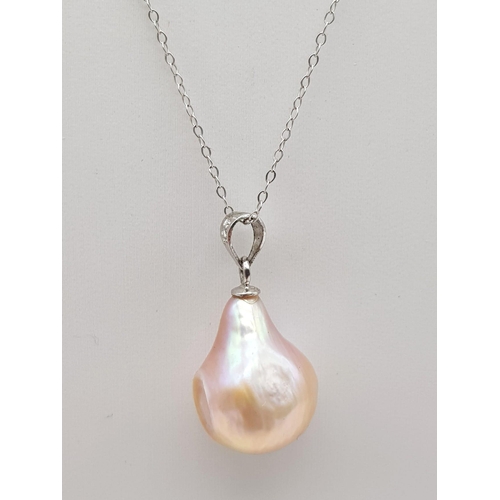 1210 - A Large Pink Baroque Pearl Pendant on a 9K White Gold Necklace. 44 and 2cm. 3.35g total weight.