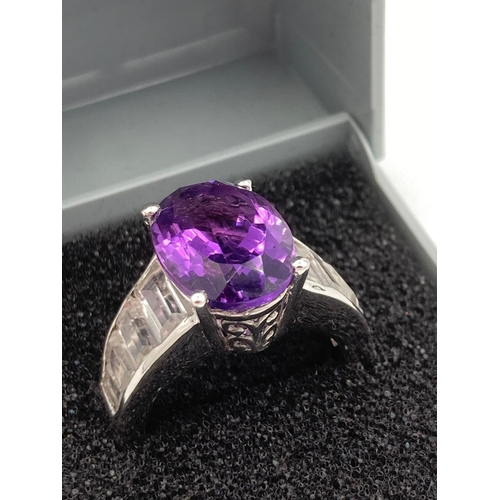134 - Magnificent AMETHYST and TOPAZ SILVER RING, Having an oval faceted 3 carat Amethyst set to top with ... 