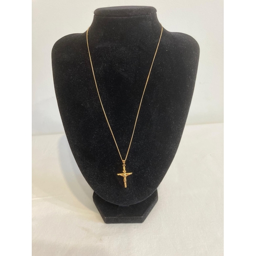 148 - 9 carat GOLD CRUCIFIX and CHAIN. Gold chain 45 cm. Gold Crucifix 3 cm drop.  1.65 grams.