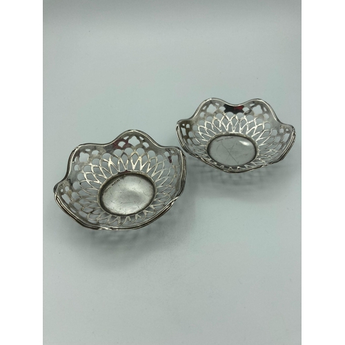 169 - Pair of SILVER BON BON DISHES presented as baskets with attractive openwork design. Clear hallmark f... 
