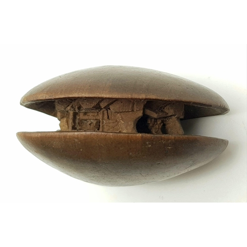 221 - Antique Meiji (1868-1912) Period, Wood Netsuke carving of a small house, set within a clam shell. In... 