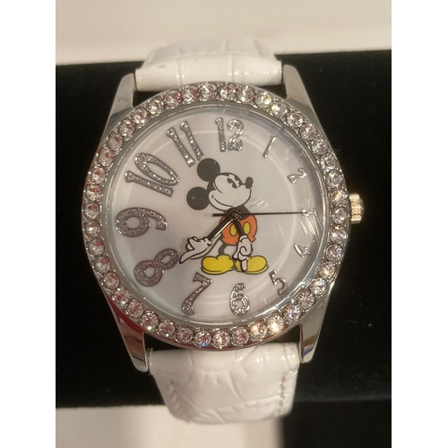 413 - White face  MICKEY MOUSE WRISTWATCH with jewelled bezel. Quartz movement .White leather strap. Full ... 