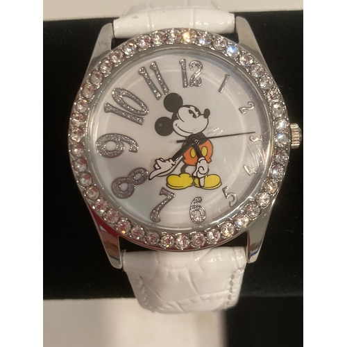 413 - White face  MICKEY MOUSE WRISTWATCH with jewelled bezel. Quartz movement .White leather strap. Full ... 