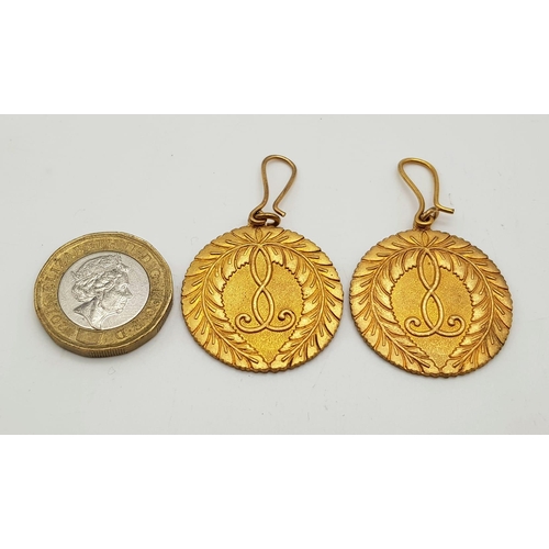 529 - A pair of Antique Brass Buddhist Earrings 14.3g