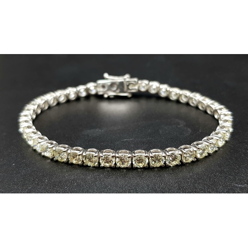 87 - A 14K White Gold Diamond Tennis Bracelet. 46 brilliant round cut diamonds. 10.25ct approx. 19cm. 12.... 