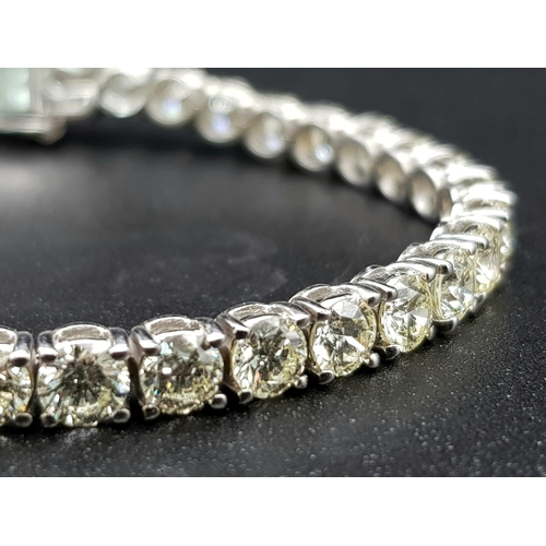 87 - A 14K White Gold Diamond Tennis Bracelet. 46 brilliant round cut diamonds. 10.25ct approx. 19cm. 12.... 