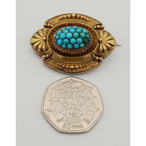 310 - A Victorian Turquoise and Pinchbeck Gold Memorial Brooch.  Oval form with central turquoise cluster.... 