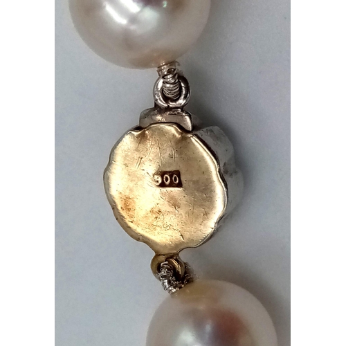 369 - A Natural Champagne-Coloured South Sea Pearl Necklace with a Platinum and Diamond Clasp. 42cm. Pearl... 