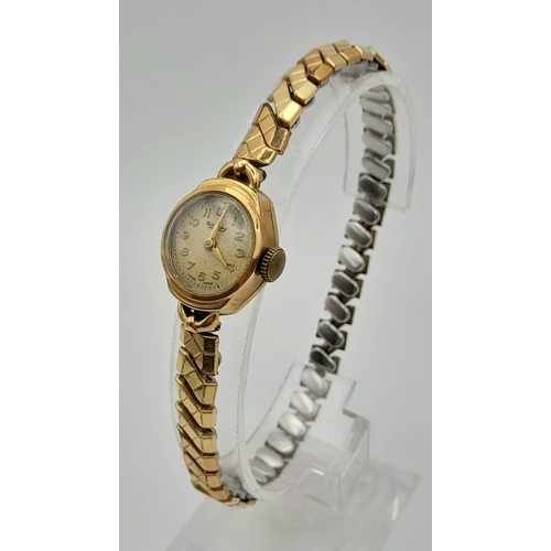 422 - A Vintage Rotary 9K Yellow Gold Cased Ladies Watch. Expandable strap. Mechanical movement. A/F.