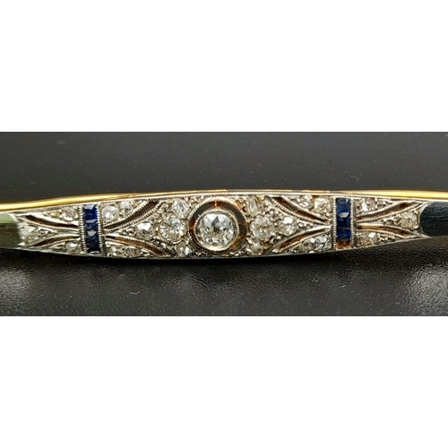 85 - An Antique Art Deco Gold, Platinum, Diamond and Sapphire Bar Brooch. 8cm. 6.47g total weight.