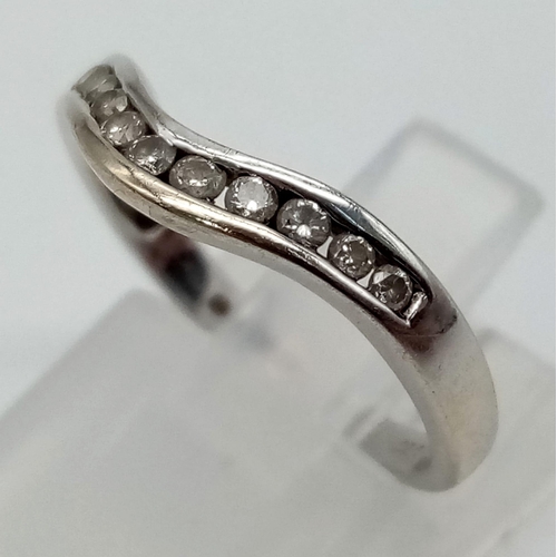 1101 - 18k White Gold Diamond Curved Band Ring. 0.20ct Diamond.
Size K, weighs 2g.