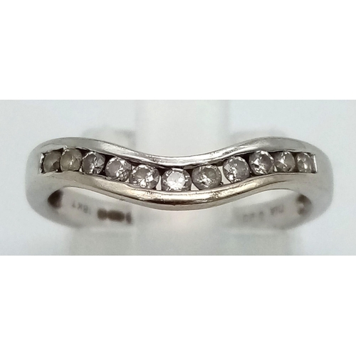 1101 - 18k White Gold Diamond Curved Band Ring. 0.20ct Diamond.
Size K, weighs 2g.