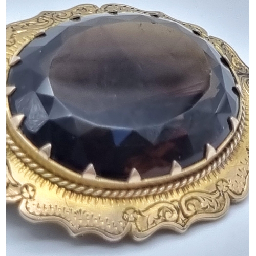 596 - A Victorian Era Large Oval Smoky Quartz Set in Gilded Silver Brooch. Over 40ct of quality faceted sm... 