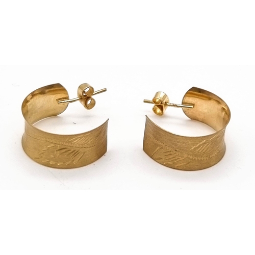 604 - 9k yellow gold 9mm wide engraved hoop earrings.
Weighs 2.44g