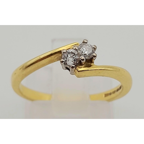 115 - 18k Yellow Gold Diamond 2 stone Twist. 0.20ct Diamond. Size N, weighs 2.82g