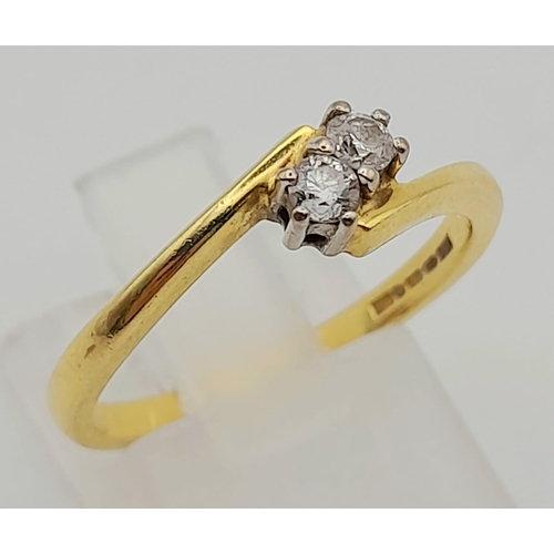 115 - 18k Yellow Gold Diamond 2 stone Twist. 0.20ct Diamond. Size N, weighs 2.82g
