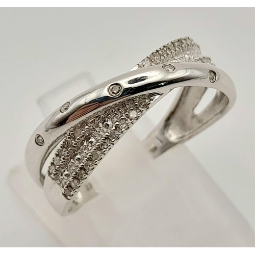 416 - 9k white gold diamond crossover ring 
Size Q, weighs 2.55g (0.36ct diamonds)