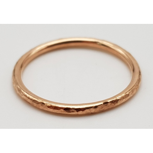 1097 - 9k rose gold hammered band ring 
Size N, weighs  1.27g