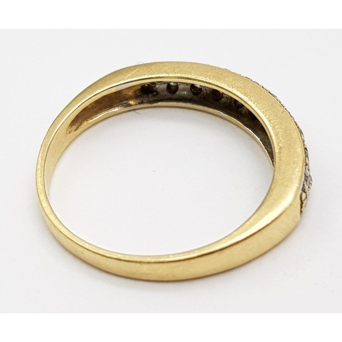 501 - 14k Yellow Gold Diamond Band Ring.
2.45g, size M.