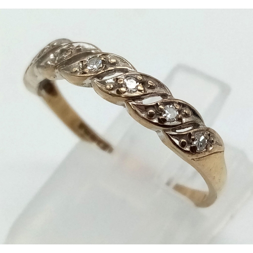1211 - 9k yellow gold crossover diamond ring 
Size P, 1.48g (0.10ct diamonds)