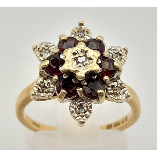 494 - 9k Yellow Gold Diamond and Garnet Cluster Ring.
Size K, weighs 3.61g