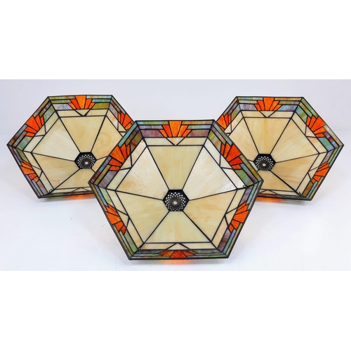 193 - Three Large Art Deco Tiffany Style Glass Lamp Shades. Warm desert colours with a geometric red motif... 