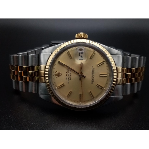 199 - A Rolex Oyster Perpetual Datejust Gents Watch. Bi-metal strap and case - 36mm. Gold dial. Automatic ... 