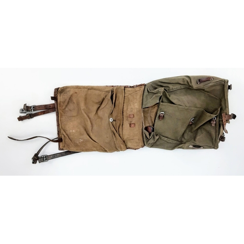 266 - WW2 German 1939 Dated Tornister/Haversack. Canvas and leather construction, with horse fur covered f... 