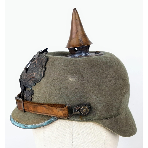 34 - WW1 Imperial German Army Prussian M15 Pickelhaube Uniform Helmet. A felt constructed example with ni... 