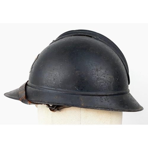 341 - WW1 French M15 Adrian Helmet with Applied Gas Troop Badge. The helmet of usual form split pin ‘comb’... 