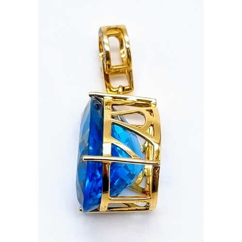 198 - An 18K Yellow Gold, Diamond and Mesmerizing Large Brazilian Blue 50ct Plus Topaz Pendant. 5cm length... 