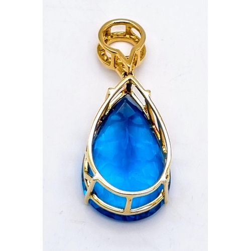 198 - An 18K Yellow Gold, Diamond and Mesmerizing Large Brazilian Blue 50ct Plus Topaz Pendant. 5cm length... 