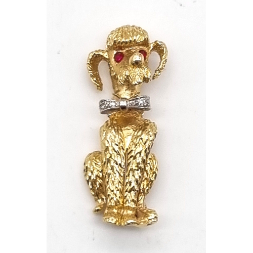 219 - 14k Yellow Gold Designer Poodle, with Diamond Bow, Ruby Eyes and makers mark. weighs 13.72G