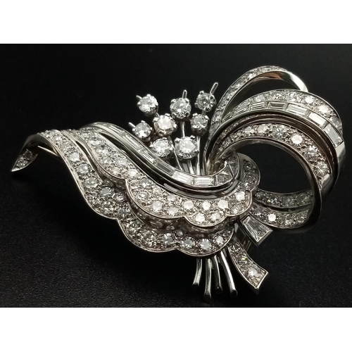 3 - A 1950s Diamond Floral Spray Brooch - set with round and baguette-cut diamonds. Mounted in platinum.... 
