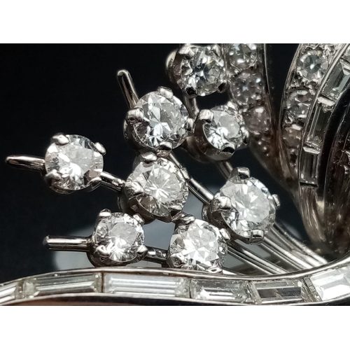 3 - A 1950s Diamond Floral Spray Brooch - set with round and baguette-cut diamonds. Mounted in platinum.... 