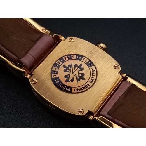 59 - A Patek Phillipe Gold and Diamond Ellipse Ladies Watch. Pink leather strap and gold buckle. Oval gol... 