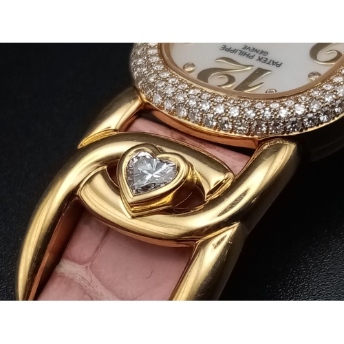 59 - A Patek Phillipe Gold and Diamond Ellipse Ladies Watch. Pink leather strap and gold buckle. Oval gol... 