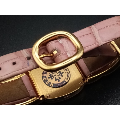 59 - A Patek Phillipe Gold and Diamond Ellipse Ladies Watch. Pink leather strap and gold buckle. Oval gol... 