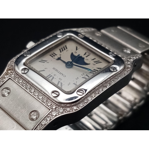 16 - A Cartier Santos Moonphase Diamond Ladies Watch. 18K Gold strap and case - 24mm. White dial with moo... 