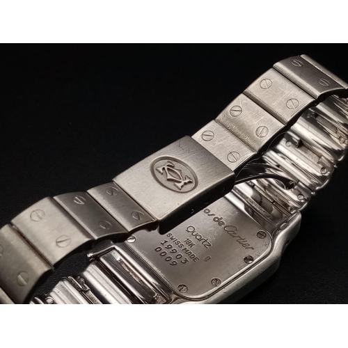 16 - A Cartier Santos Moonphase Diamond Ladies Watch. 18K Gold strap and case - 24mm. White dial with moo... 