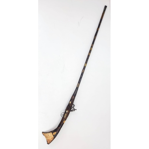 254 - An Antique Afghan Flintlock Long Rifle “Jezail” Brass and Wood Finish 165cm Length.