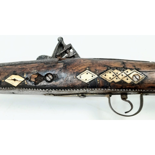 254 - An Antique Afghan Flintlock Long Rifle “Jezail” Brass and Wood Finish 165cm Length.