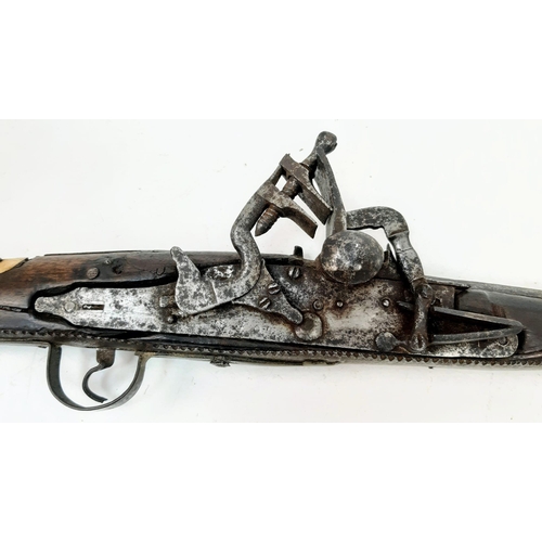 254 - An Antique Afghan Flintlock Long Rifle “Jezail” Brass and Wood Finish 165cm Length.