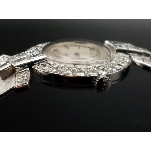 332 - A Chopard 18K White Gold and Diamond Ladies Watch. White gold strap and case - 25mm diameter. Diamon... 